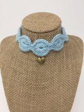 Load image into Gallery viewer, Picture of a light blue pet collar with a gold colored pendant around a tan brown bust