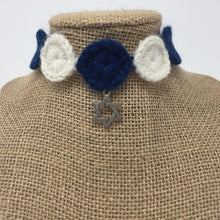 Load image into Gallery viewer, Close up picture of a Blue and ivory hand-knitted pet collar with star of David star around a tan brown bust