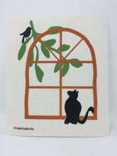 Load image into Gallery viewer, White cat-themed sponge cloth dish rack towel with a black cat looking up at a black bird