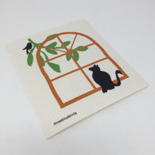 Load image into Gallery viewer, White cat-themed sponge cloth dish rack towel with a black cat looking up at a black bird