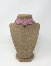 Load image into Gallery viewer, Picture of a Mauve pink hand-knitted Alpaca pet collar with gold colored pendant around a tan brown bust