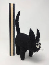 Load image into Gallery viewer, Picture of a black felt cat toy standing on a white surface with a ruler behind it
