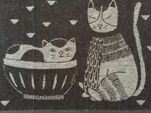 Load image into Gallery viewer, Close up picture of a black and white cat-themed kitchen towel 
